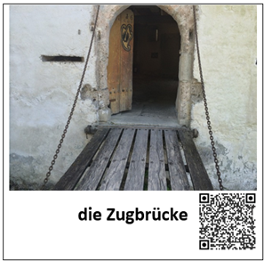 Ein Bild einer Zugbrücke ist mit den Worten "die Zugbrücke" beschriftet. Daneben befindet sich ein QR-Code, welcher zur auditiven Darstellung des Begriffes führt.