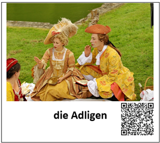 Ein Bild eines adligen Paares ist mit den Worten "die Adligen" beschriftet. Daneben befindet sich ein QR-Code, welcher zur auditiven Darstellung des Begriffes führt.