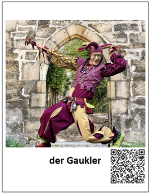 Ein Bild eines Gauklers ist mit den Worten "der Gaukler" beschriftet. Daneben befindet sich ein QR-Code, welcher zur auditiven Darstellung des Begriffes führt.